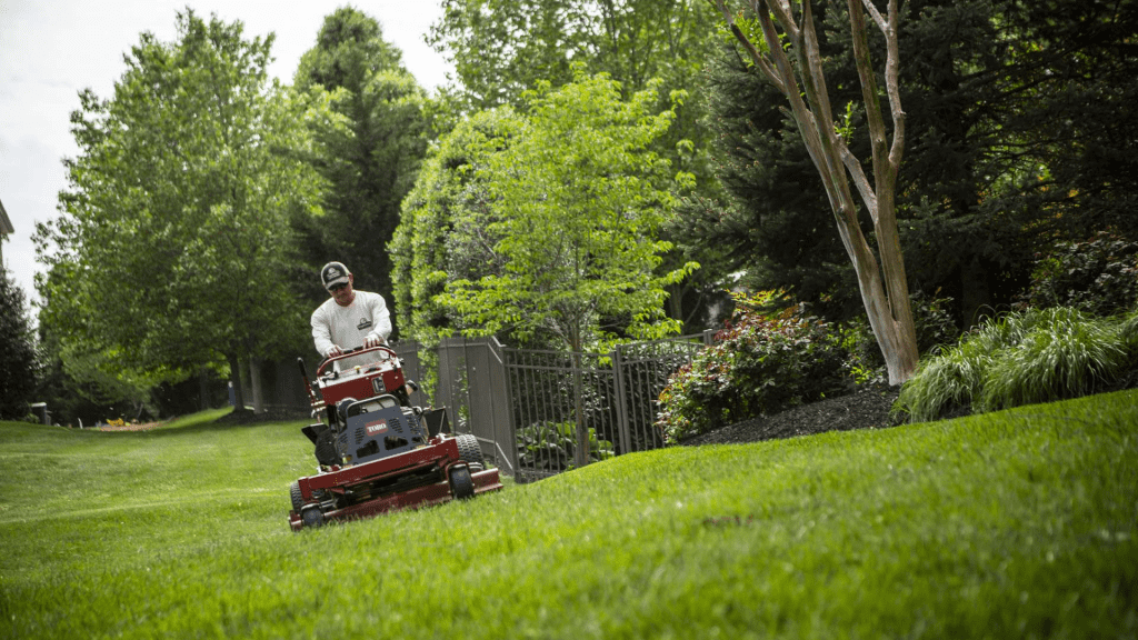 Father’s Trusted Lawn Care and Landscaping crew mowing a residential lawn in Lake City, Florida